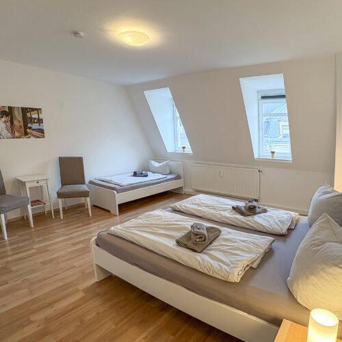 Am Stadtpark - Schlafzimmer 1 mit 3 Betten